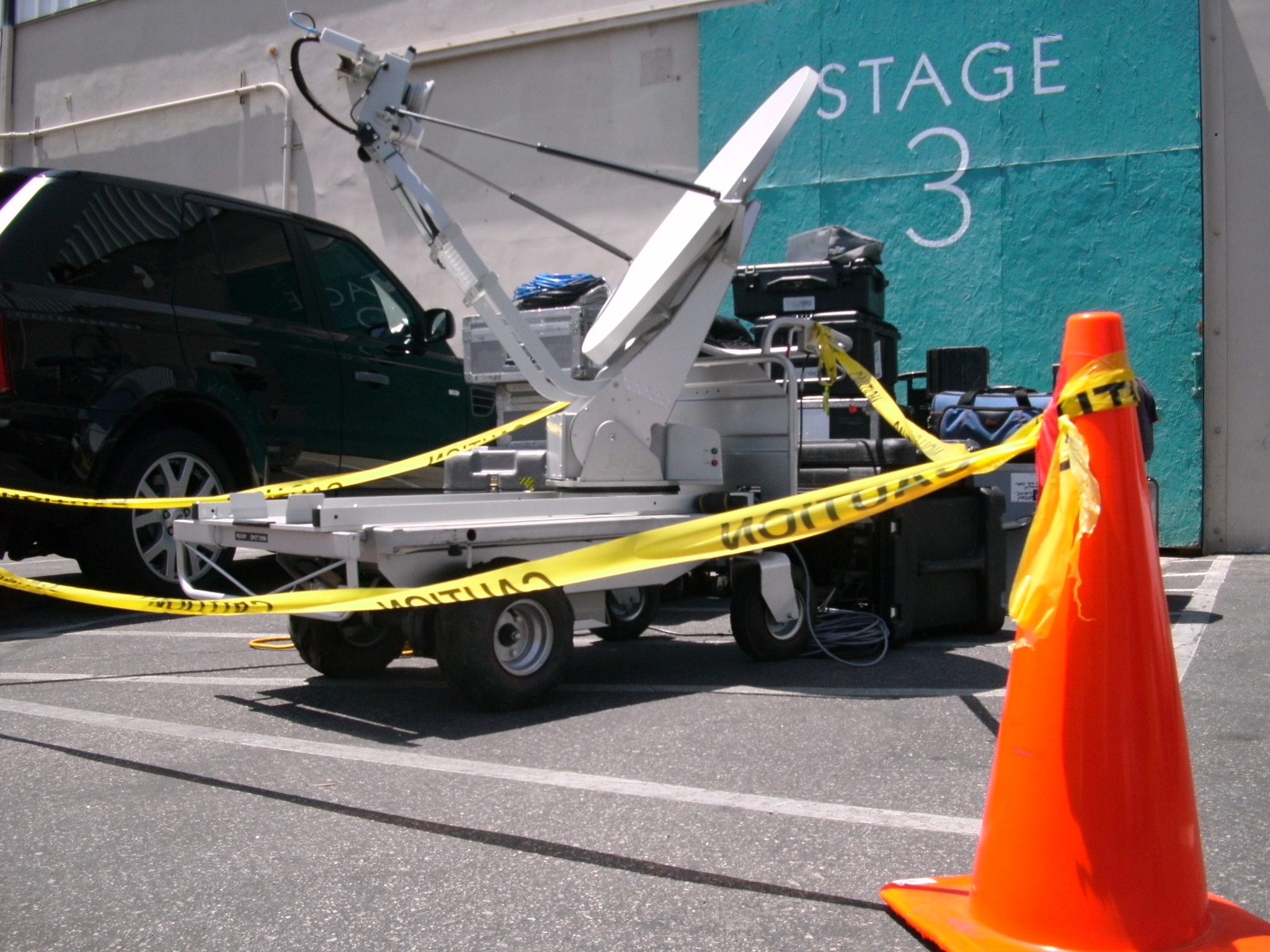 Satellite uplink rover deployed outside Stage 3 beside production equipment
